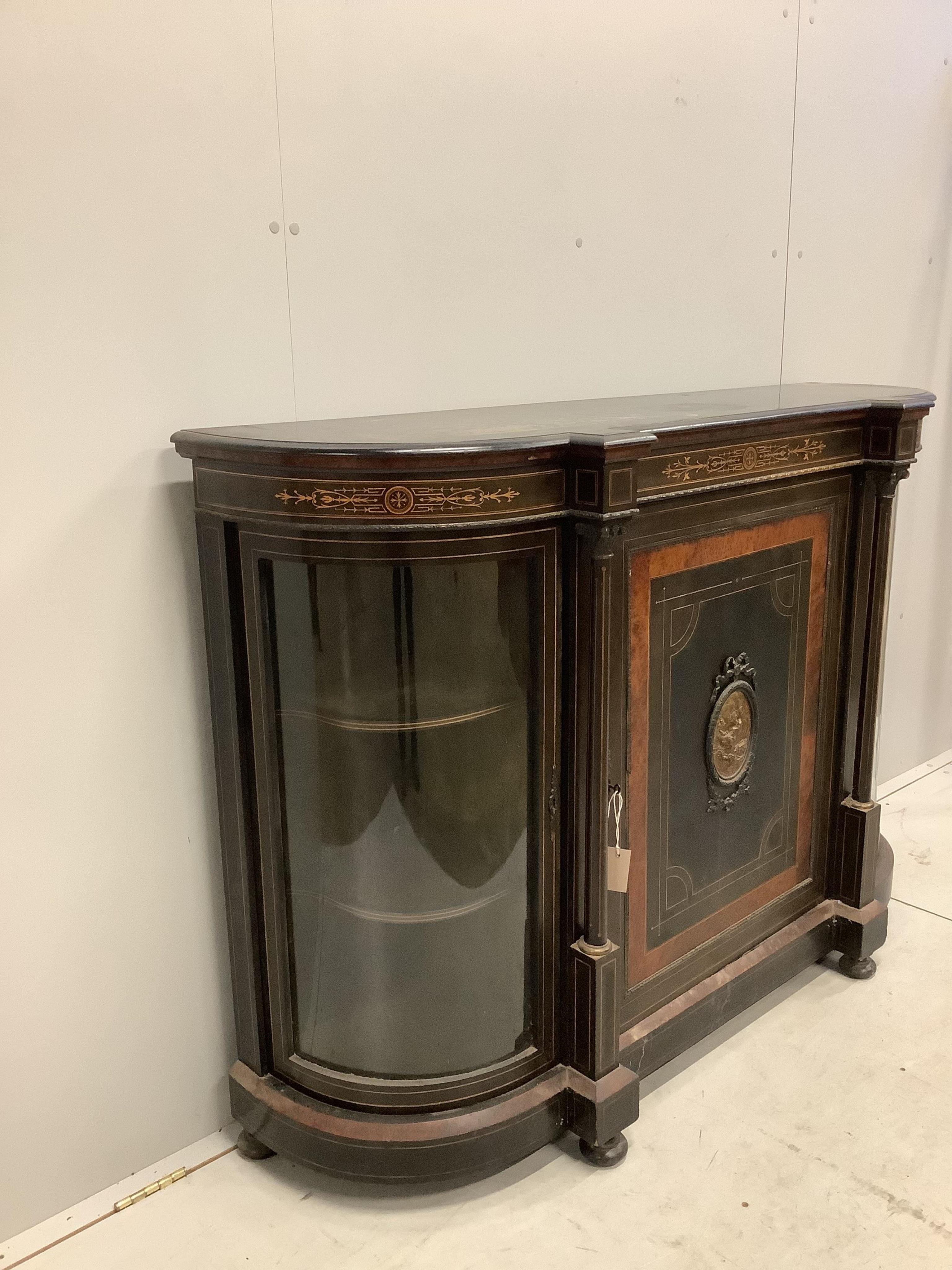 A late Victorian gilt metal mounted amboyna banded ebonised credenza, width 150cm, depth 44cm, height 106cm. Condition - poor